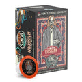 The front of the Bones Coffee Company White Russian 12 Count Bones Cups box. Its flavor is cream and coffee liqueur, and it has a skeleton wearing sunglasses with a goatee in a comfy coat with a white tee shirt holding a cup of coffee on the art.